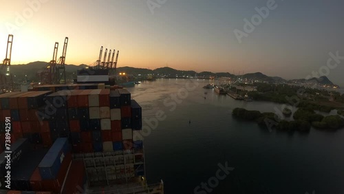 Manzanillo, Mexico - 23.05.2023 Timelapse of container ship arrive to the port and has loading operations with few gantry cranes in Manzanillo Container Terminal.