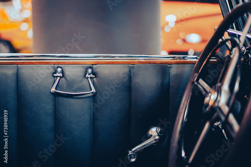 The interior of the front door of an oldtimer old car photo