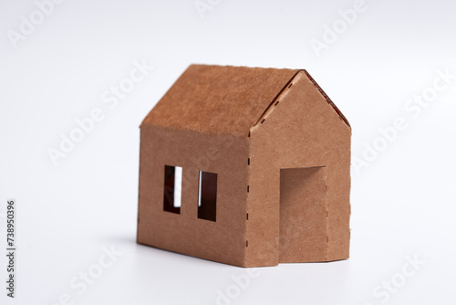 simple DIY family home - cardboard model on wite background