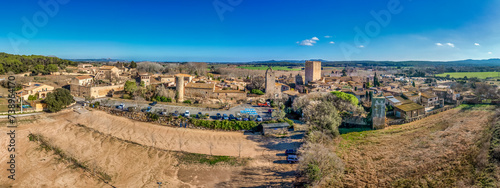 Fototapeta Naklejka Na Ścianę i Meble -  Aerial view of Peratallada, historic artistic small fortified medieval town with castle  in Catalonia, Spain near the Costa Brava. Stone buildings rutted stone streets and passageways.