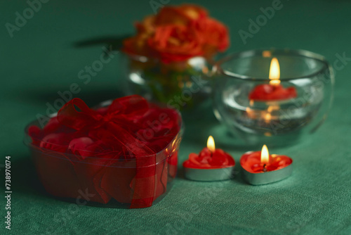 Bouquet of roses, candles and gifts, card for February 14, Valentine's Day, March 8, International Women's Day, wedding, birthday, mother's day, blurred background, bokeh.