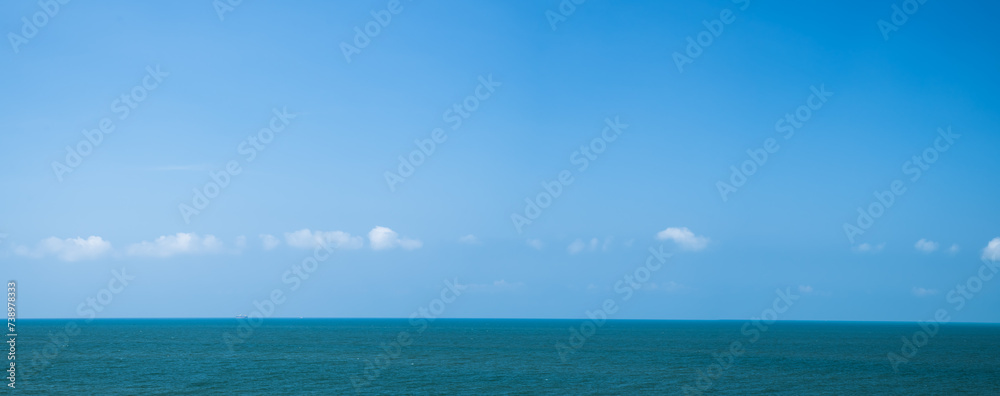 Fototapeta premium Panoramic beautiful blue sea on sky background