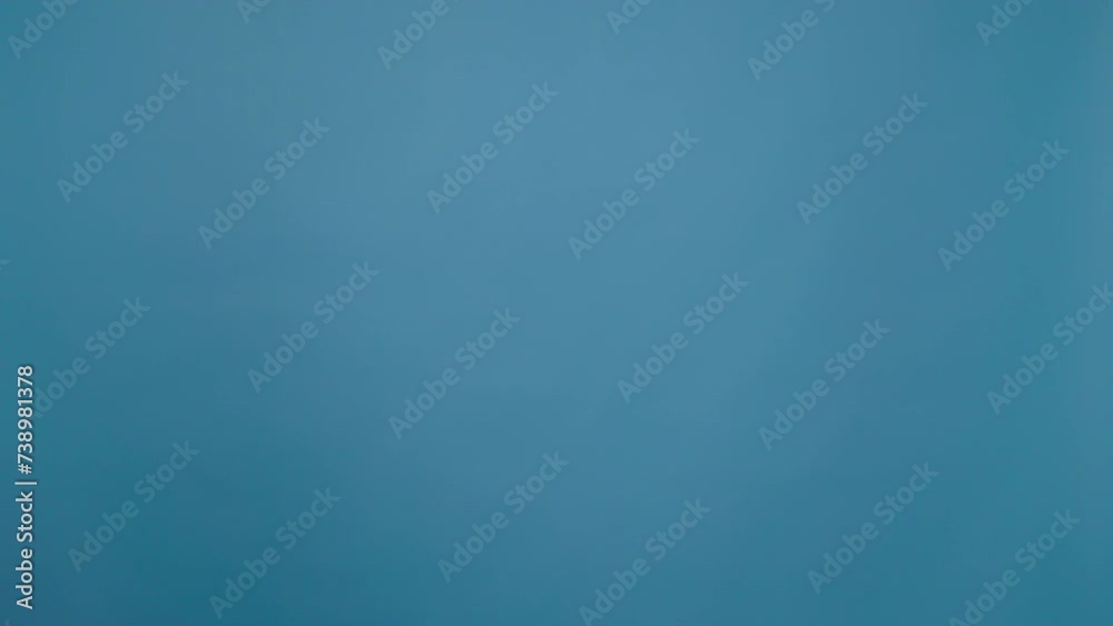 Happy carefree woman dancing and feeling happy over blue background Happy carefree woman dancing and feeling happy over blue background