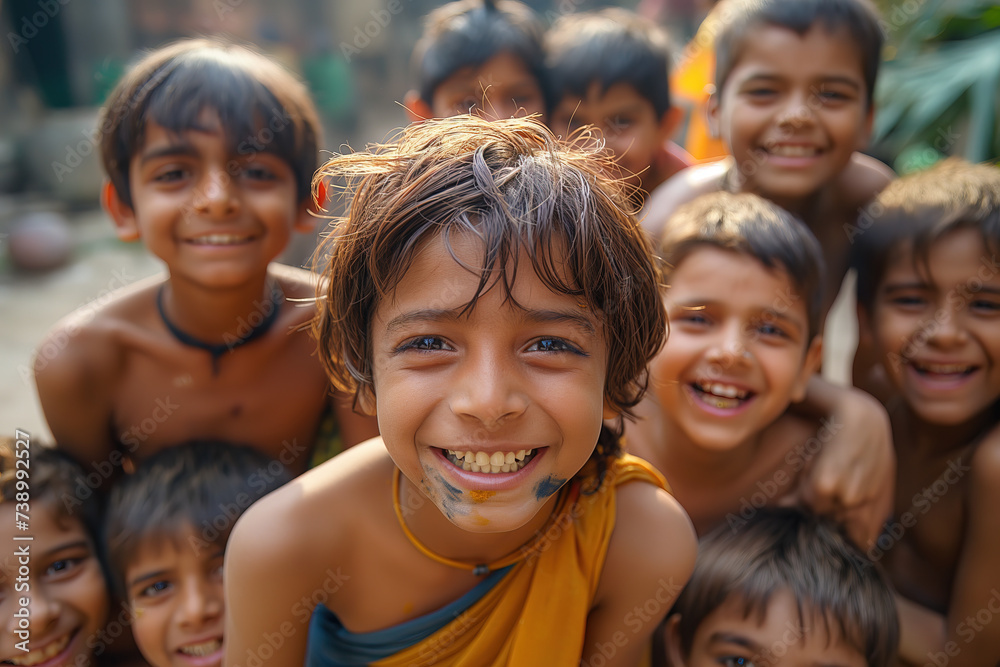 A group of boys on the street in India, holi colors festival, smile and laugh to the camera, wide angle close up