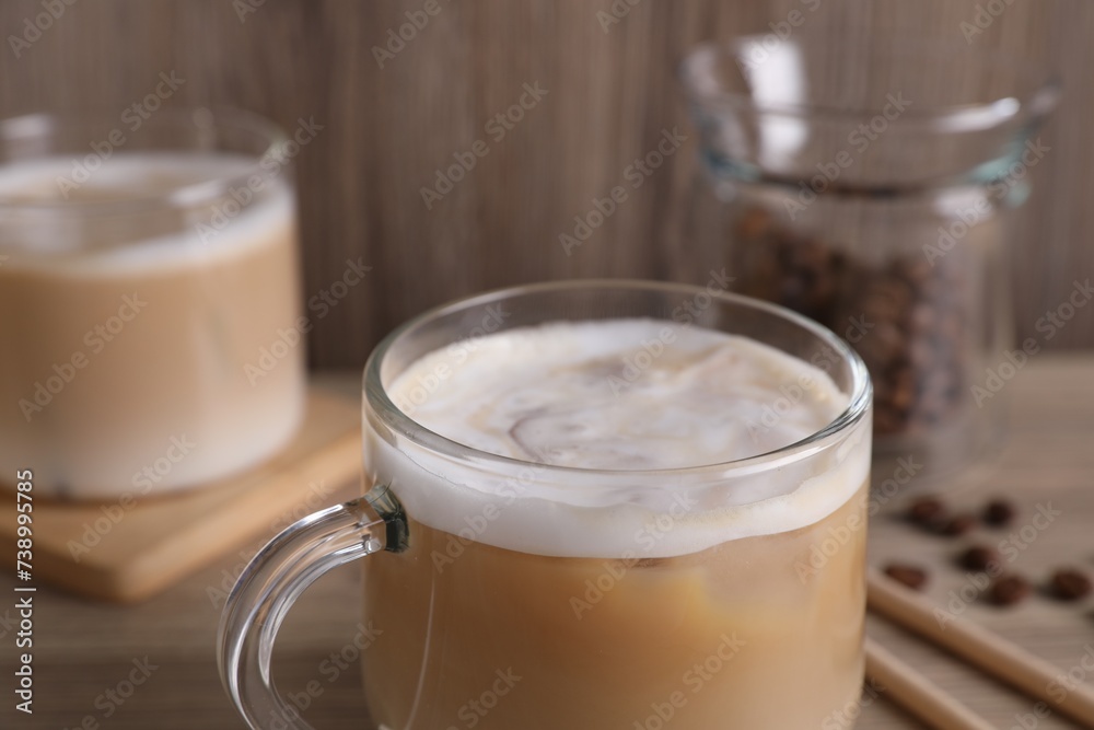 Cup of fresh coffee on wooden table, closeup Cup of fresh coffee on wooden table, closeup