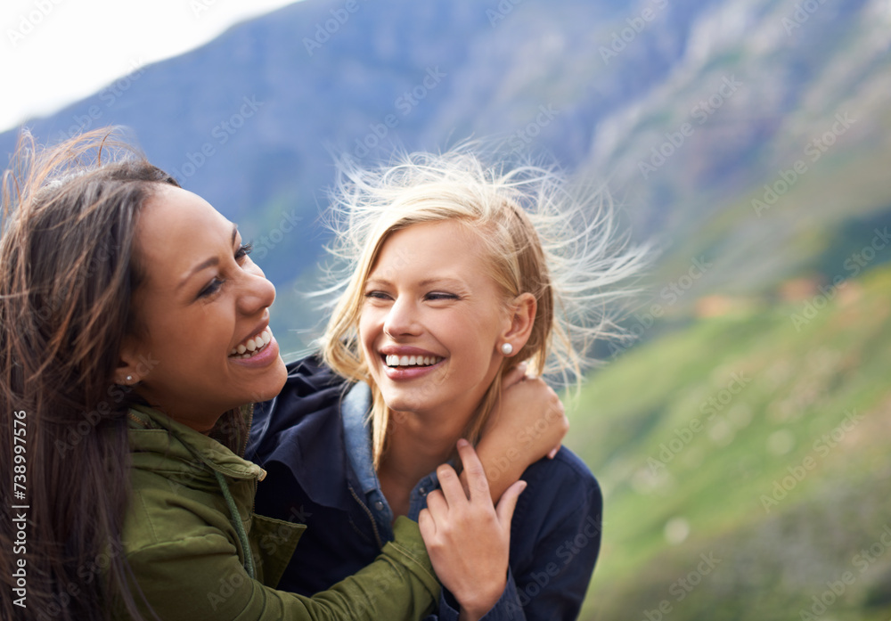 Happy woman, friends and laughing with hug in nature for funny joke, humor or bonding together. Female person with smile for embrace, care or support on holiday weekend, travel or outdoor vacation Happy woman, friends and laughing with hug in nature for funny joke, humor or bonding together. Female person with smile for embrace, care or support on holiday weekend, travel or outdoor vacation