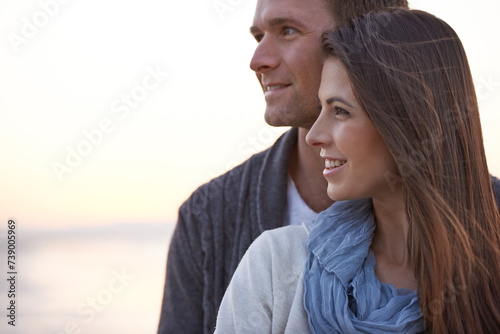 Couple, thinking and hug with love outdoor at sunset planning future holiday together in Florida. Travel, ideas and man with woman on beach, vacation or date in summer with support in marriage