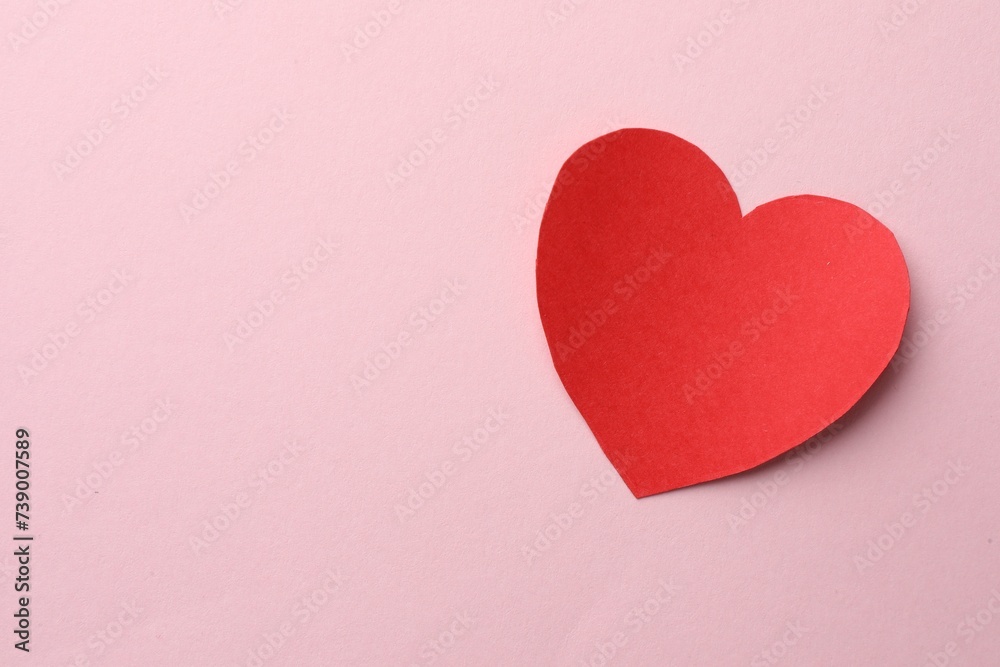 One paper heart on pink background, top view. Space for text