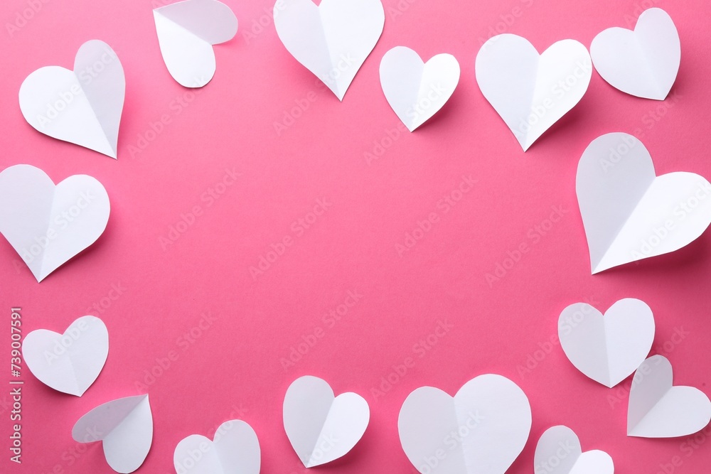 Frame of beautiful white paper hearts on pink background, flat lay. Space for text