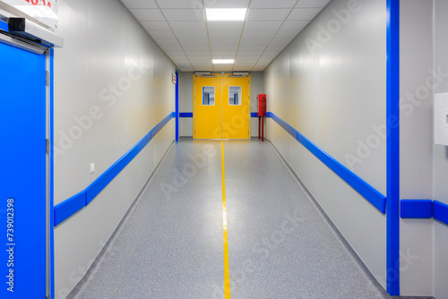 The door at the end of the hospital corridor. Background with selective focus and copy space