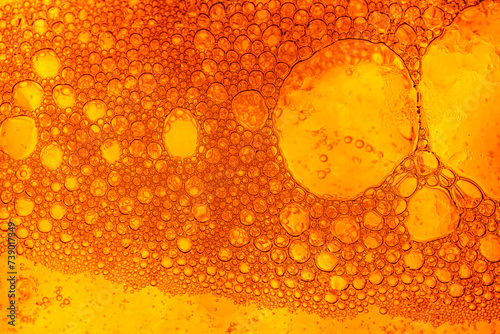 Close-up macro yellow bubble texture,Close up of golden liquid, bubbles, and pipette