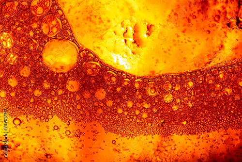 Close-up macro yellow bubble texture,Close up of golden liquid, bubbles, and pipette