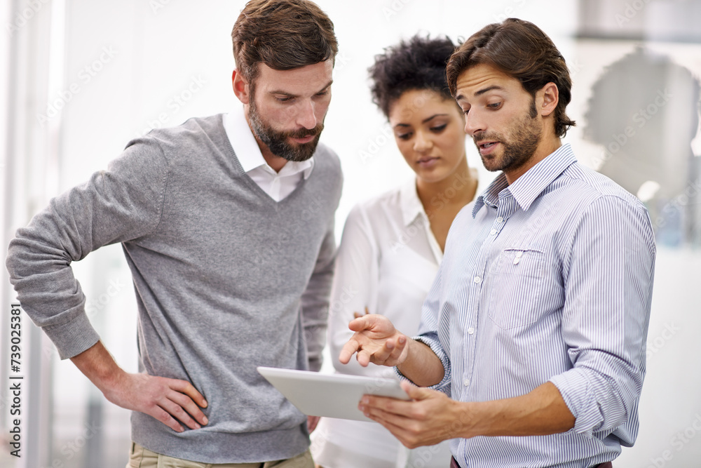 Businessman, tablet and coaching with team for research, planning or brainstorming at office. Group of young employees or colleagues with technology for discussion, project or networking at workplace