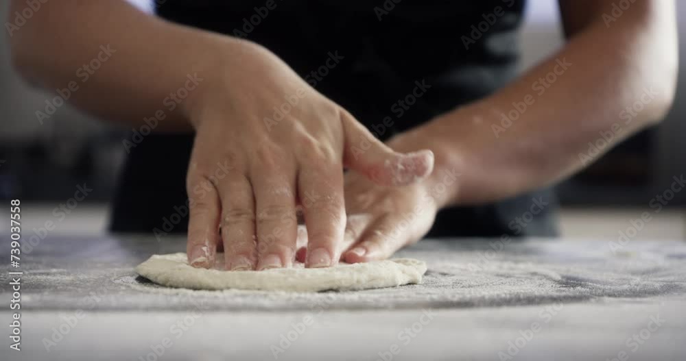 Chef, hands and dough with wheat on kitchen table for baking, cooking or pizza process in apartment. Person, bakery and pastry for recipe, handmade cake or bread with flour or preparation in home Chef, hands and dough with wheat on kitchen table for baking, cooking or pizza process in apartment. Person, bakery and pastry for recipe, handmade cake or bread with flour or preparation in home