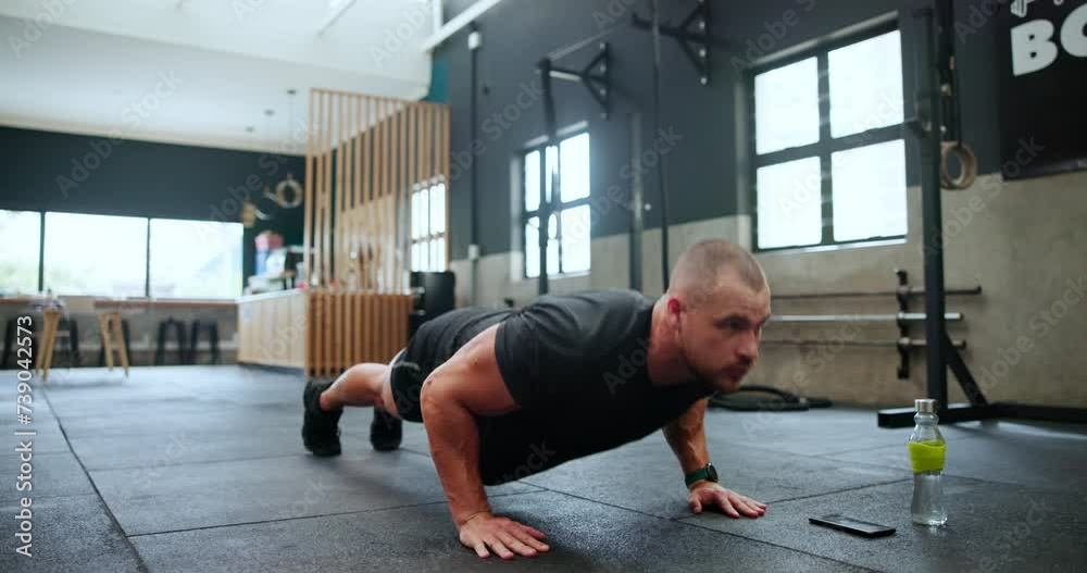 Man, fitness and push ups at gym in workout, strength or exercise on floor in endurance. Active male person, bodybuilder or athlete lifting body weight for strong arms, chest or biceps at health club Man, fitness and push ups at gym in workout, strength or exercise on floor in endurance. Active male person, bodybuilder or athlete lifting body weight for strong arms, chest or biceps at health club