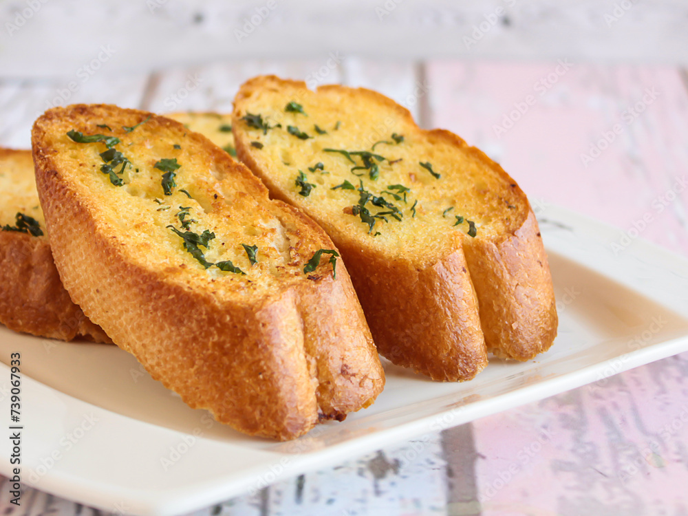 GARLIC BREAD Toast served in dish isolated wooden table top view arabic food appetizer