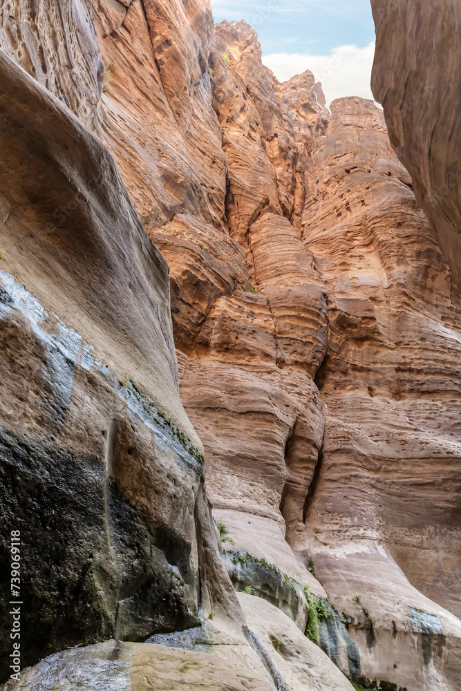 The unearthly beauty of the high mountains on the both sides of the dry stream in the gorge Wadi Al Ghuwayr or An Nakhil and the wadi Al Dathneh near Amman in Jordan