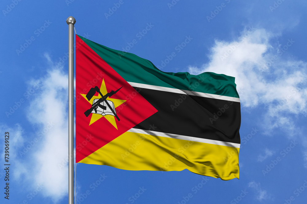 Mozambique flag fluttering in the wind on sky. Mozambique flag fluttering in the wind on sky.