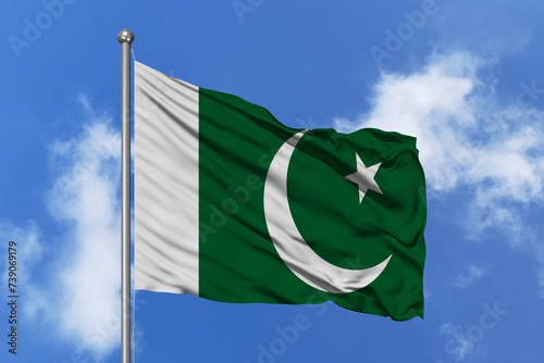 Pakistan flag fluttering in the wind on sky.