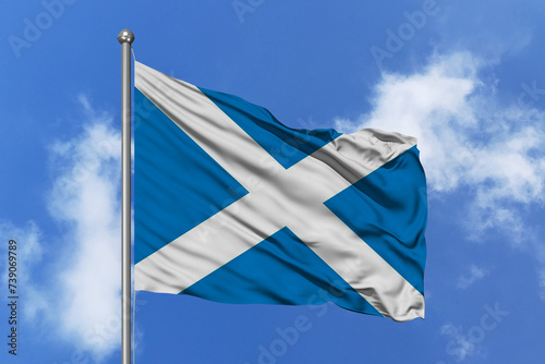 Scotland flag fluttering in the wind on sky.