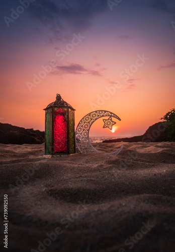 Eid Mubarak photography, Crescent moon with colourful lantern on the beach sand, Ramadan Kareem greeting background