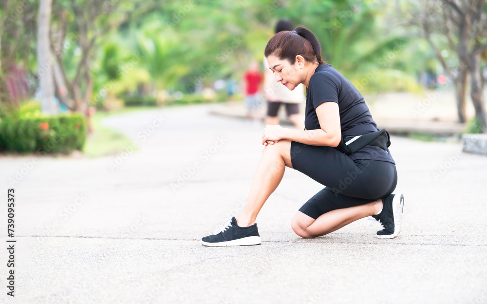 Athlete running woman Knee injury on woman after traning for warm up her muscle. Athlete running woman Knee injury on woman after traning for warm up her muscle.