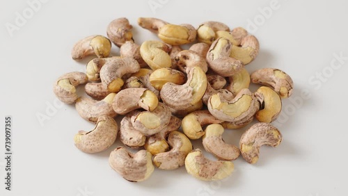 roasted salted cashew nuts on whtie background. photo