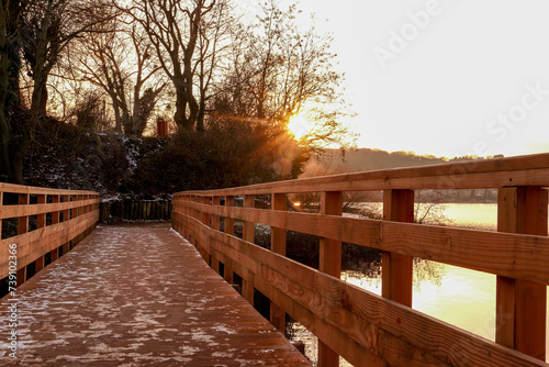 perspective of a wooden pontoon on a lake in winter