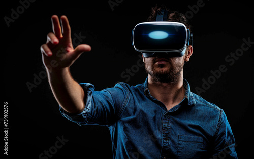 handsome man in vr glasses  playing with virtual reality headset  trying to touch something with hand