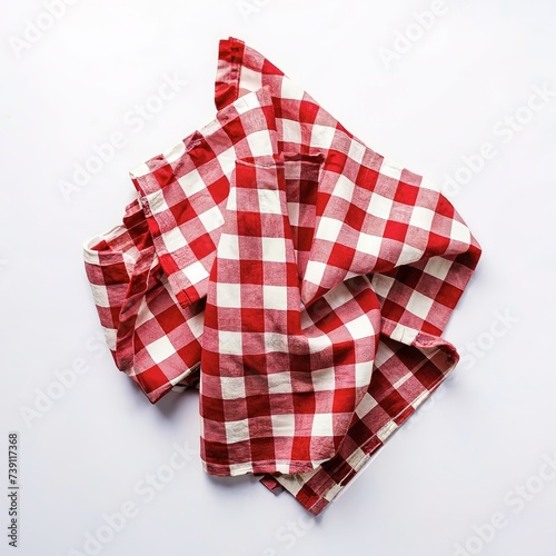 Top view napkin checkers red and white on a white background. Fabric crumpled red and white Isolated with copy space.