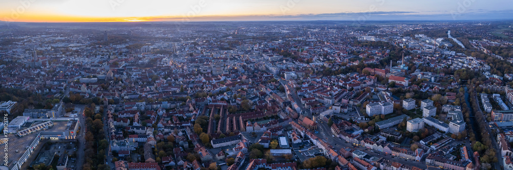 Aerial around the old town of the city Augsburg in Germany on a late afternoon in autumn