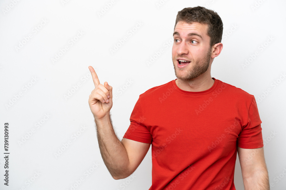 Young caucasian man isolated on white background intending to realizes the solution while lifting a finger up