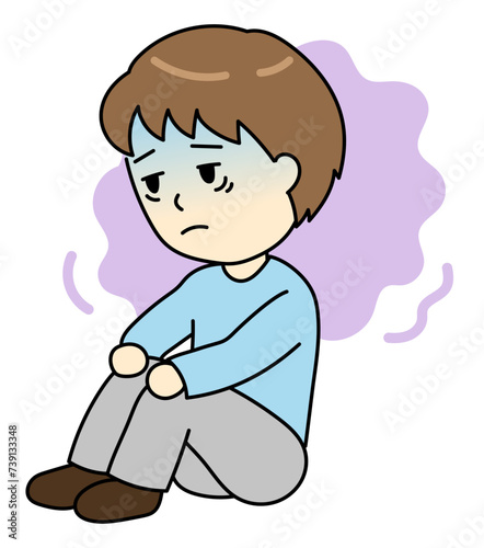 うつ病で気分が落ち込む体育座りの若い男性