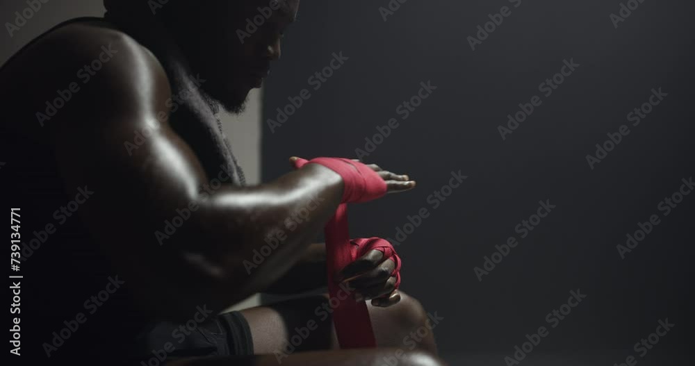 Black man, boxer and wrapping hands in locker room for competition or ...