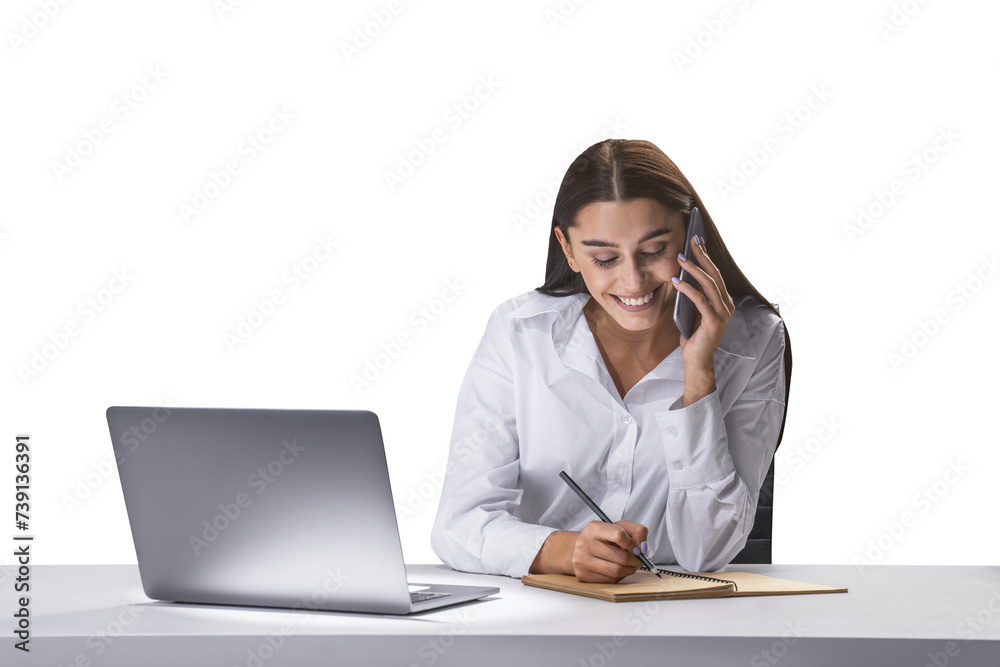 Cheerful businesswoman on phone taking notes, laptop open on desk, multitasking concept Cheerful businesswoman on phone taking notes, laptop open on desk, multitasking concept