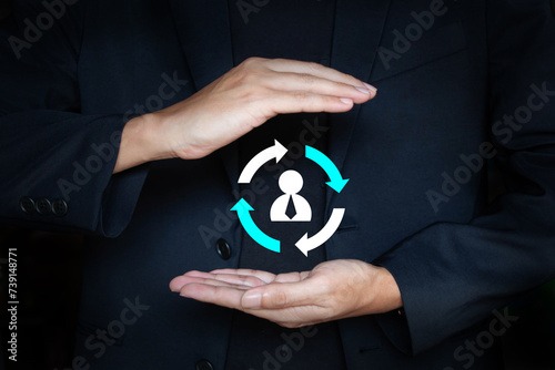 Customer retention and customer care icon on hand of business man; Human resource management; Staff turnover or job rotation concept photo