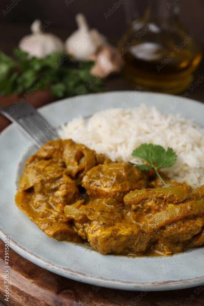 Delicious chicken curry with rice on table, closeup