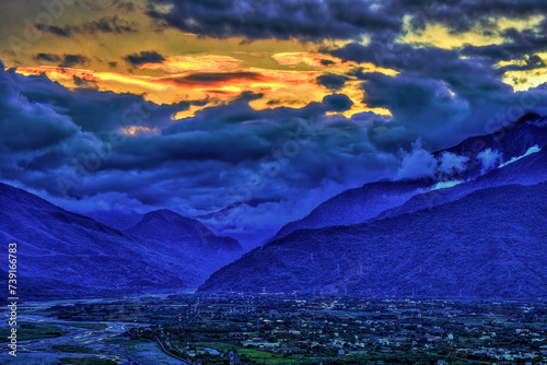 Magnificent rolling mountains and city night view at sunset blue hour, photography in Hualien City, Hualien County, Taiwan.For branding, screensavers,websites,calendar,cover .High quality photography	 photo
