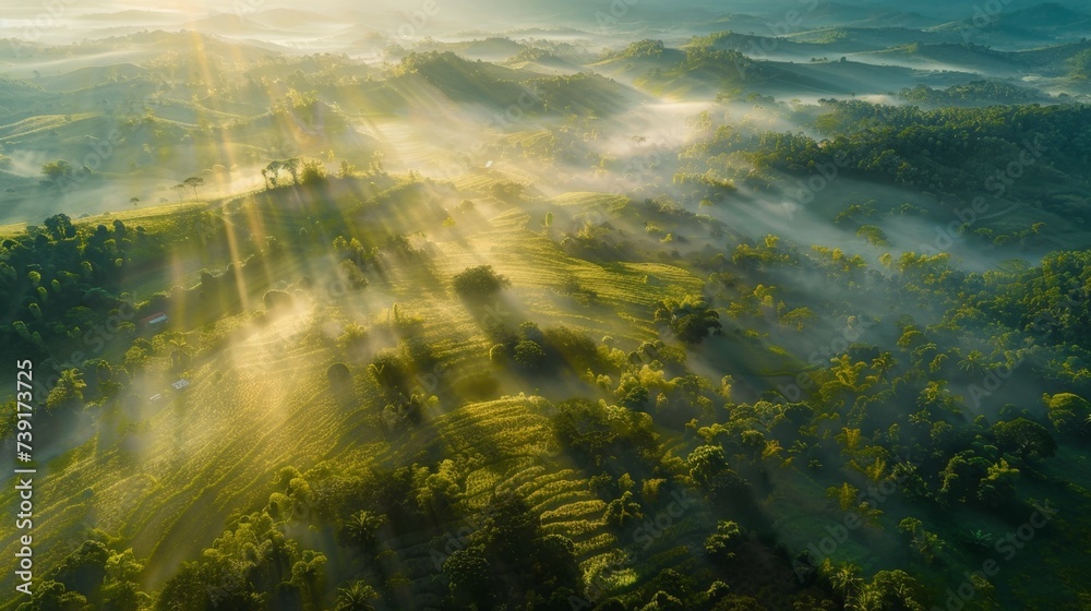 aerial view of sunrise over mountains with some fog, backlight scene