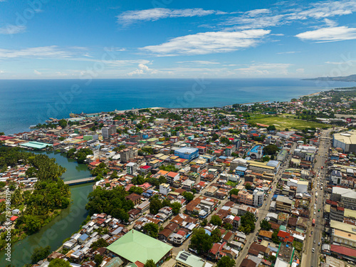 Iligan City: Highway between commercial buildings. Northern Mindanao, Philippines.