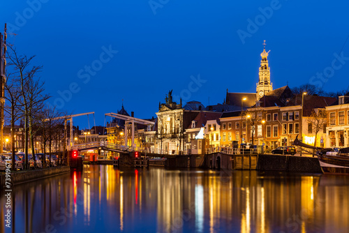 Scenic summer view of the Old Town architecture and Spaarne canal embankment in Haarlem, Netherlands