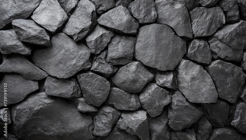 Close-up detailed of textured black rocks or gravel, uniformly spread. Highlights natural patterns and shapes Close-up detailed of textured black rocks or gravel, uniformly spread. Highlights natural patterns and shapes