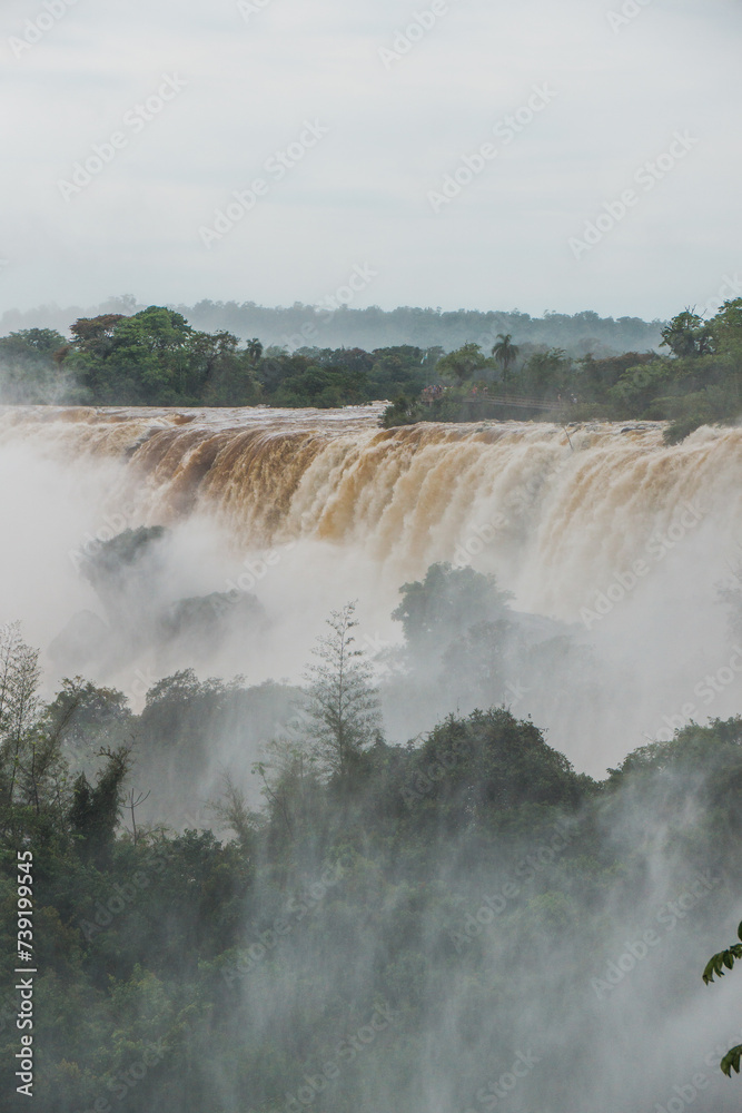 A close-up photo of the Iguazu waterfalls with a rising current.