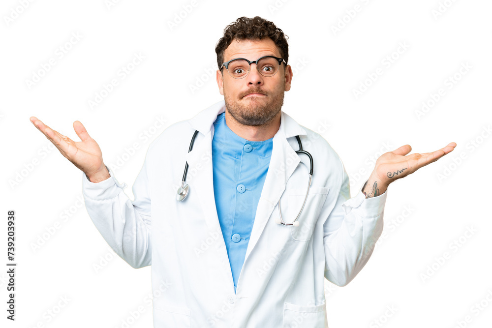 Brazilian doctor man over isolated chroma key background having doubts while raising hands Brazilian doctor man over isolated chroma key background having doubts while raising hands
