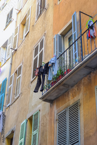 Nice, France, 02/13/2024: The architecture of the old town in Nice boasts a blend of Italian style with French motifs, characterized by colorful houses and narrow streets. photo