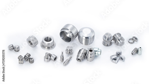 An assortment of nuts and bolts on a white background