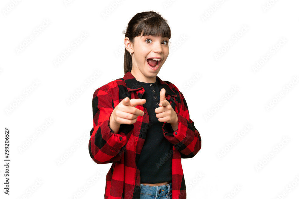 Little girl over isolated green chroma key background surprised and pointing front Little girl over isolated green chroma key background surprised and pointing front
