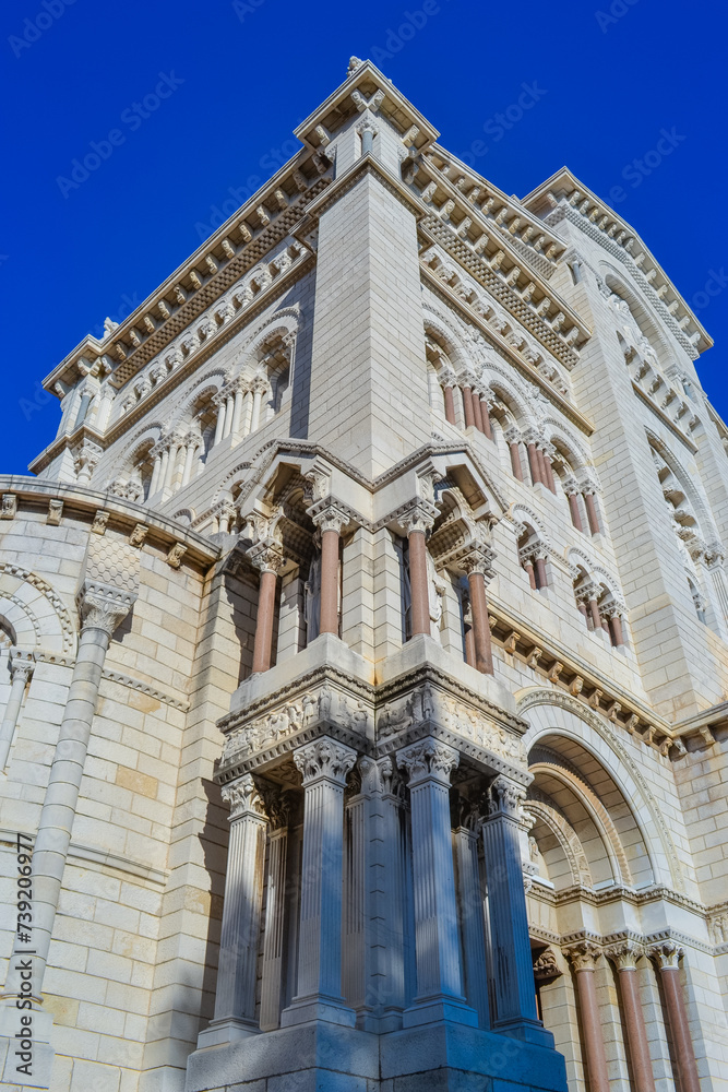 Small part of the facade of the Cathedral of St. Nicholas in Monaco against the blue sky