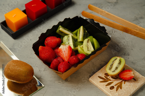 sliced strawberry and kiwi
