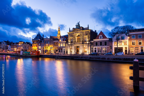 Night View of Harlem Sight on Spaarne River On The Background At twilight photo